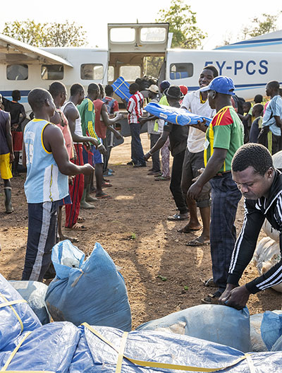 Offloading a plane of donated goods