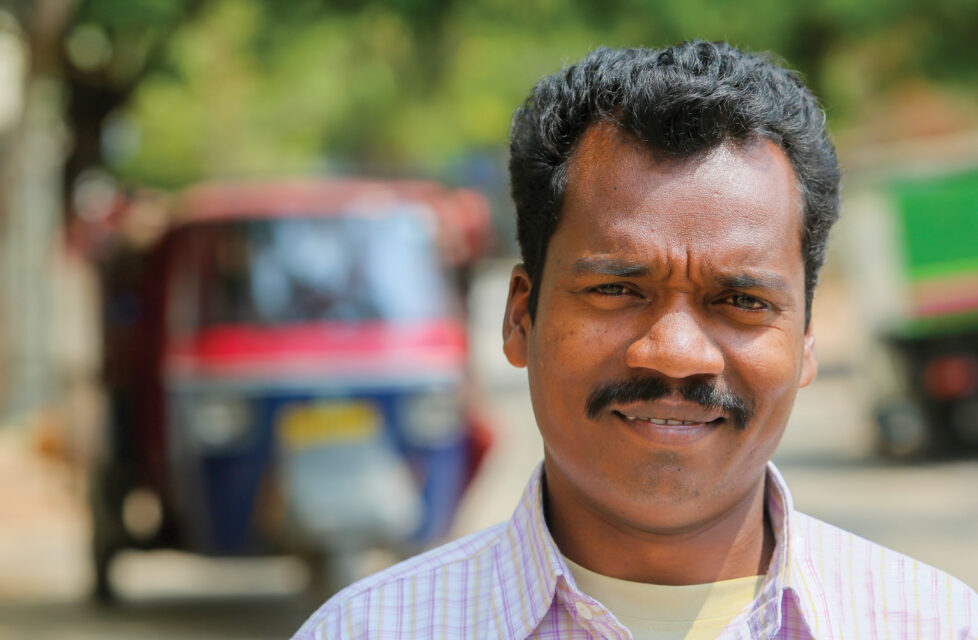 A man facing the camera smiling
