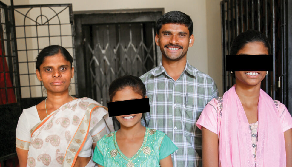 A family looking at the camera and smiling